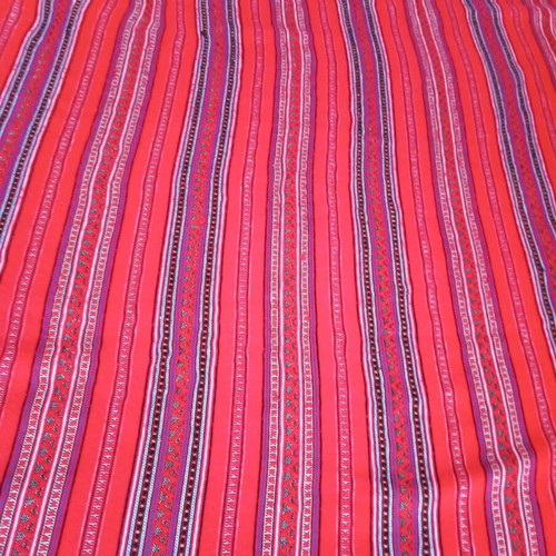 Woven blanket cover used, striped wool