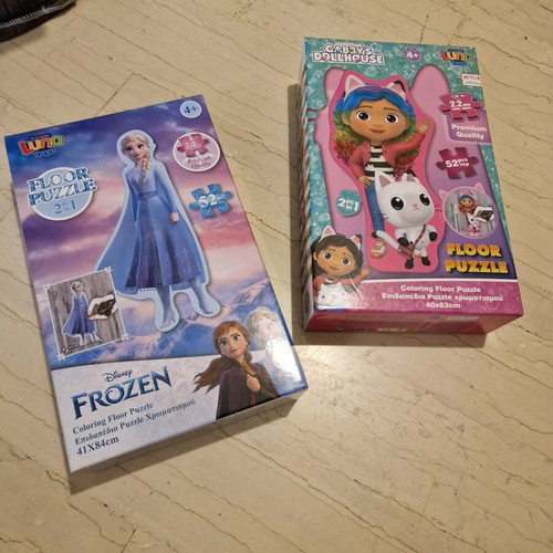 Frozen and Gabby's Dollhouse puzzles used, 52 pieces each