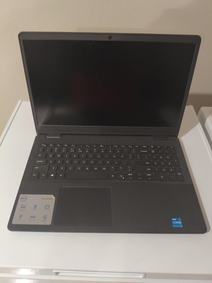Dell Vostro 15 3000 laptop with 8GB RAM, charger, mouse, and case