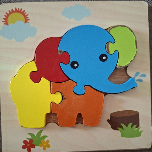 Wooden puzzles for children used, owl and elephant