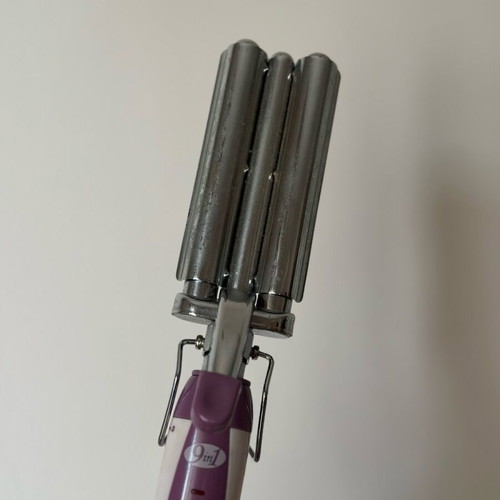 Triple hair curler used for wavy hair
