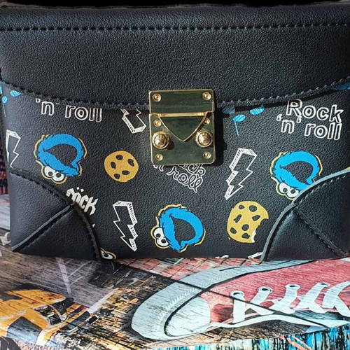 Shoulder bag like new with Rock'n' Roll prints, black and blue