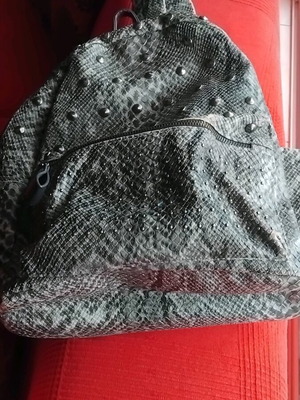 Snakeprint backpack used, grey with snake pattern and studs