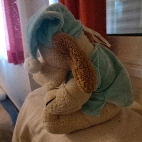 Stuffed animal dog in pajamas used with small seam opening