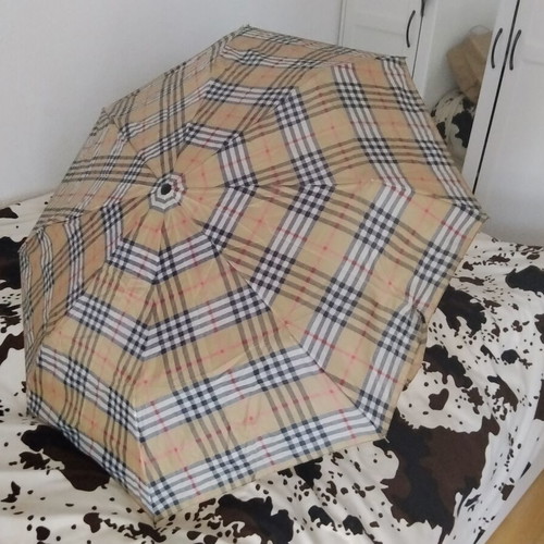 Vintage unisex folding umbrella with wooden handle, used