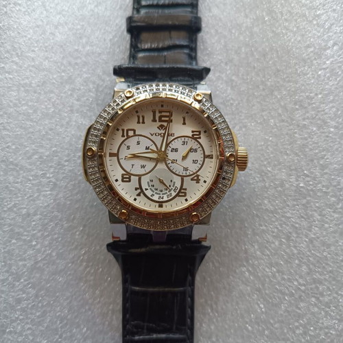 Vogue watch used with white dial and black leather strap