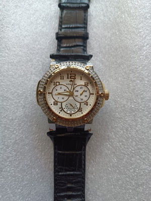 Vogue watch used with white dial and black leather strap