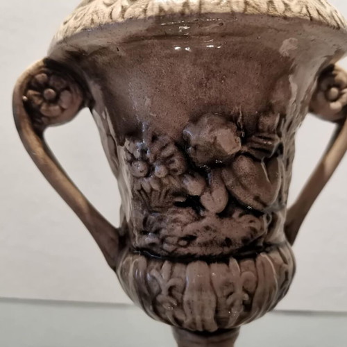 Faience amphora used with embossed design and cupids