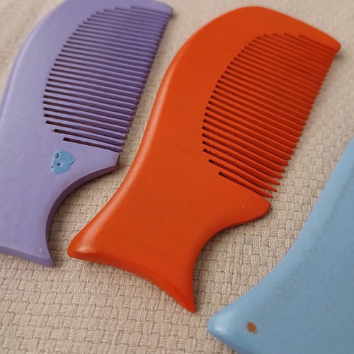Wooden combs with handmade painted designs