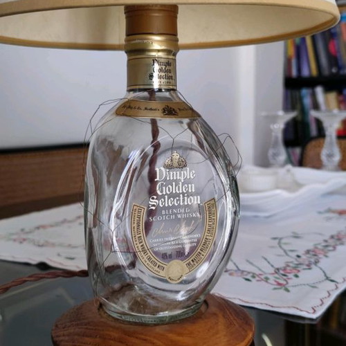 Dimple Golden Selection lamp used with handmade papyrus shade and wooden base