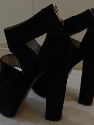 Black platforms size 36 mint condition with gold zipper