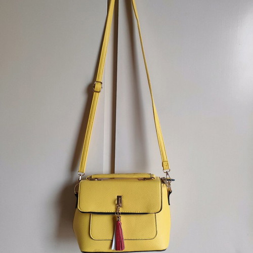 Yellow crossbody bag used with detachable strap