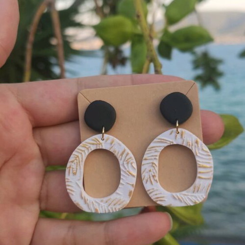 Earrings new, polymer clay with black, white, and gold colors