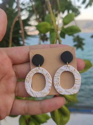 Earrings new, polymer clay with black, white, and gold colors