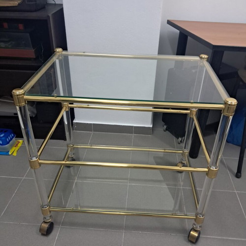 Glass coffee table with wheels, gold color