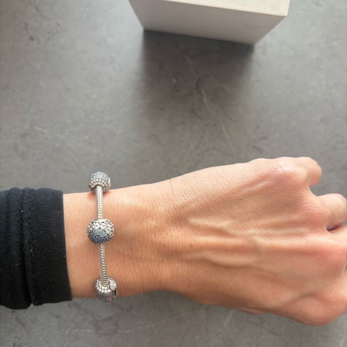Pandora silver bracelet new with 4 charms and zirconia