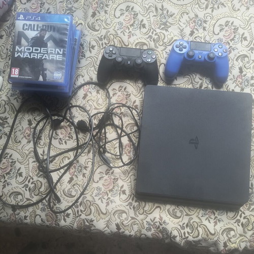 PlayStation 4 Slim 1TB used with 6 games and 2 controllers