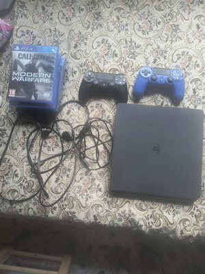 PlayStation 4 Slim 1TB used with 6 games and 2 controllers