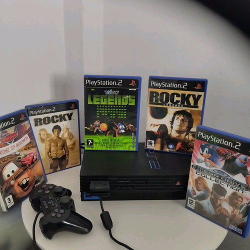 PlayStation 2 used with games, controller, and memory card