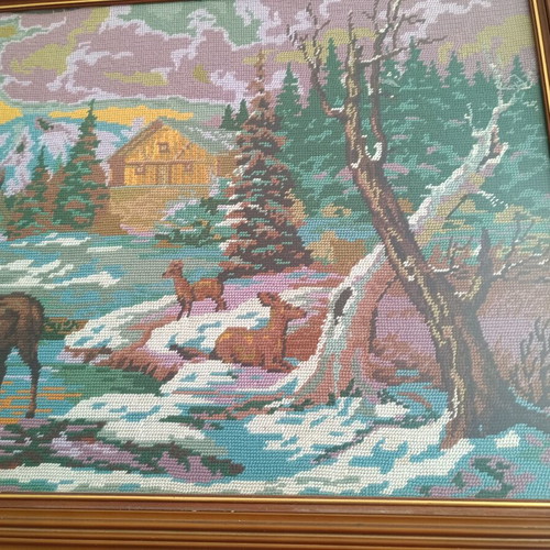 Handmade cross-stitch embroidery in wooden frame, used