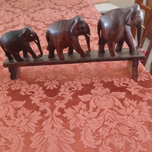 Wooden elephant set on base, like new, three sizes, handmade