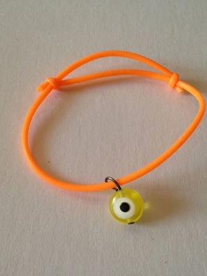 Bracelet with yellow evil eye bead used