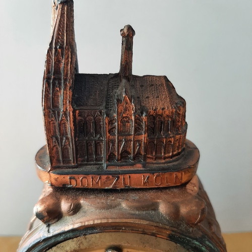 Copper German wind-up clock used with cathedral motif