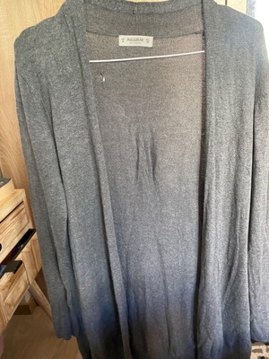 Thin gray cardigan used with small defect on back