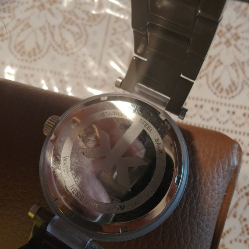 IKI Men's Quartz Watch with Brown Dial and Roman Numerals