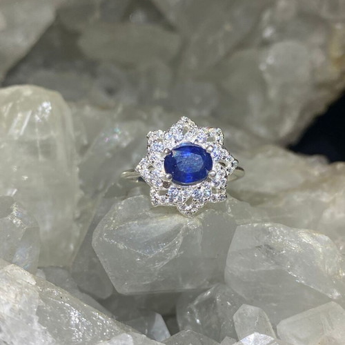 Handmade silver ring with natural blue sapphire and moissanites
