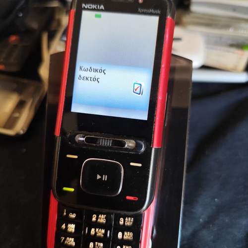 Nokia 5610 XpressMusic phone used with charger