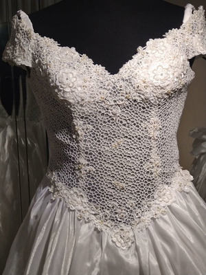Unique wedding dress with guipure lace bust embroidered with pearls and strass