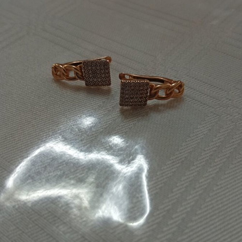 Gold earrings like new with small diamonds