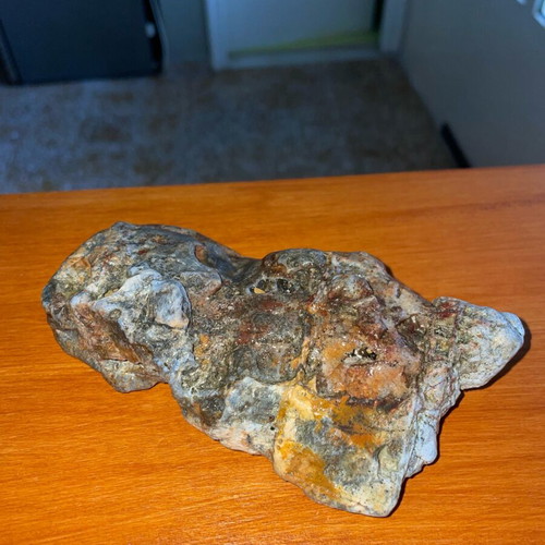 Natural rock with quartz and iron oxides