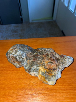 Natural rock with quartz and iron oxides