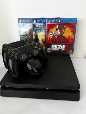PlayStation 4 Slim 500GB console like new with 2 controllers and games