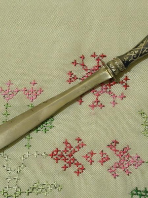 Silver letter opener used with carved details and sabati enamel