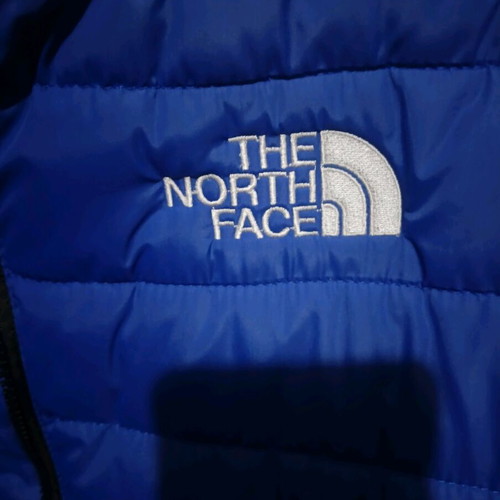 The North Face blue jacket like new, size M unisex