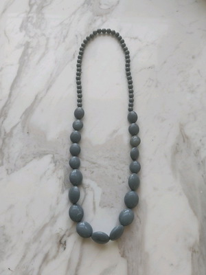 Long necklace with gray celluloid beads used