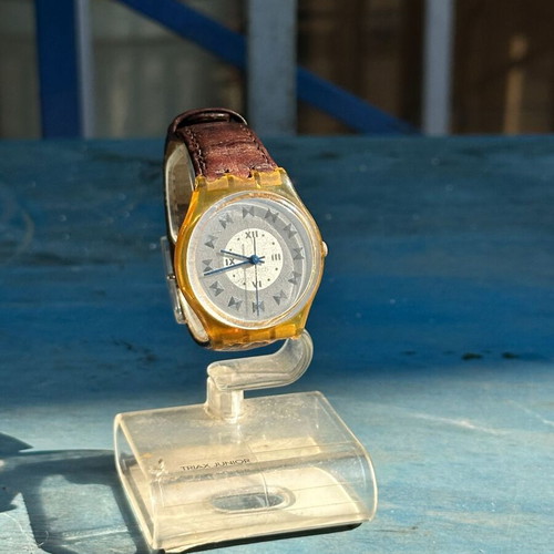 Vintage Swatch Swiss watch 34mm, transparent yellow case, brown strap