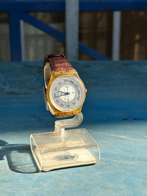 Vintage Swatch Swiss watch 34mm, transparent yellow case, brown strap