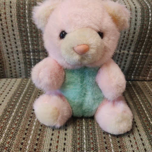 Teddy bear used with bell, pastel colors, 90s decade