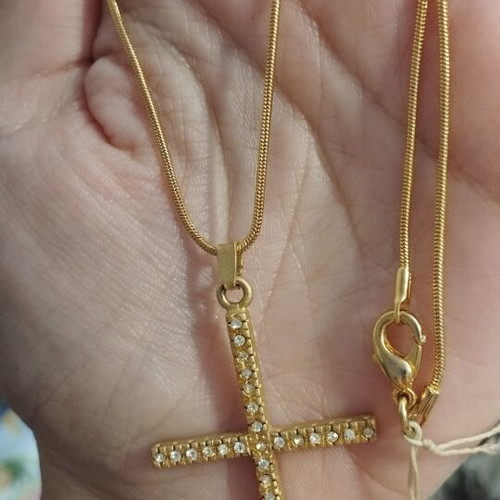 Gold-colored cross necklace with rhinestones
