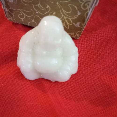 Alabaster-style miniature Buddha, smiling