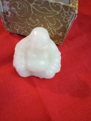 Alabaster-style miniature Buddha, smiling
