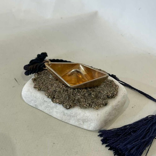 Handmade table charm with bronze boat and marble stone