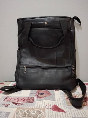Black backpack-style bag made of leatherette like new