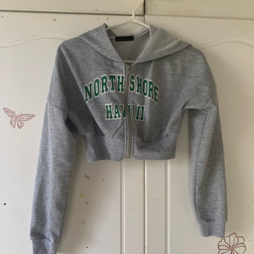 Cropped zip up hoodie used, grey with green lettering, size XS