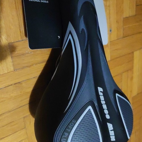 Bicycle saddle new, soft with rear reflector and adjustable front