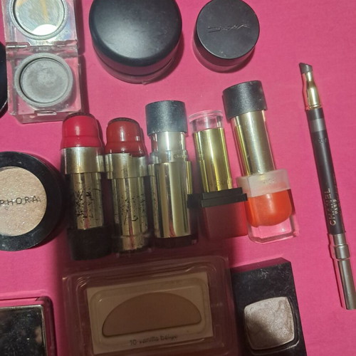 Large collection of branded cosmetics with YSL mirror and makeup bag
